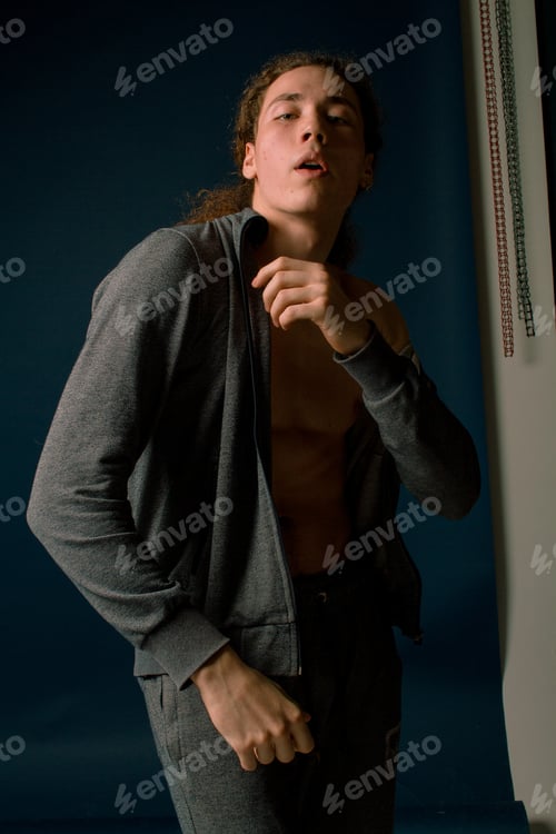 Preview: Attractive And Stylish Guy With Curly Hair And A Sports Figure