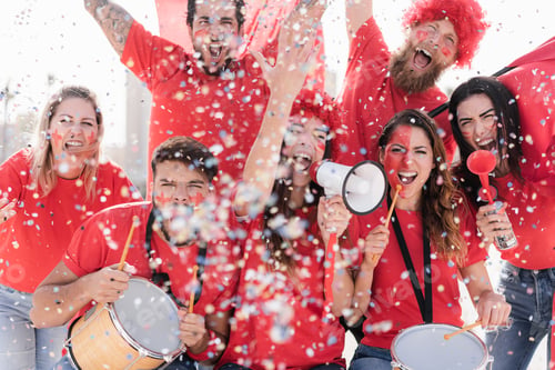 Preview: Red sport fans screaming while supporting their team out of the stadium
