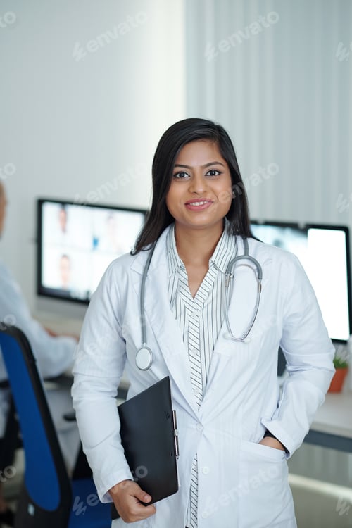 Preview: Positive female physician in medical office
