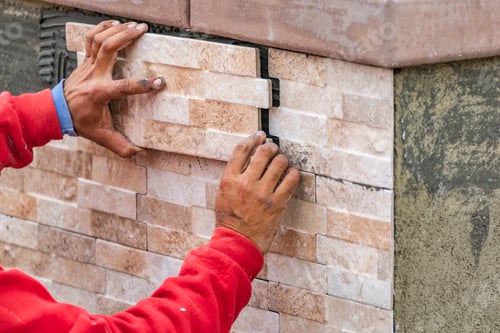 Preview: Worker Installing Wall Tile at Construction Site