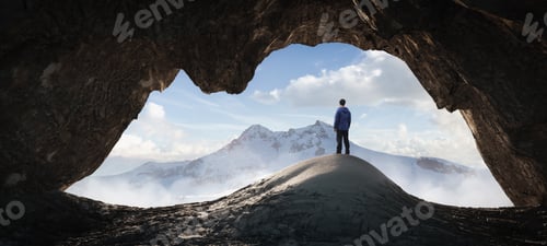 Preview: Adult Hiker Male standing inside a rocky mountain cave overlooking the nature scene