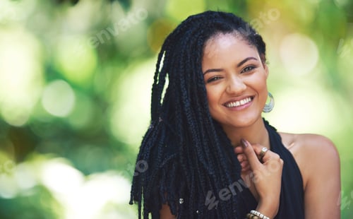 Preview: Life is too short to be anything but happy. Portrait of an attractive young woman posing outdoors.