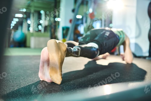 Preview: Man of spirit practicing plank exercise