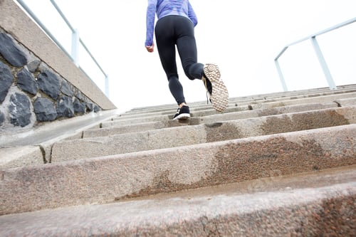 Preview: Female runner on wet staircase outside