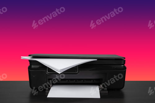 Preview: Home laser printer on desk against purple background