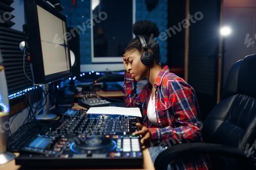 Preview: Female sound operator in audio recording studio