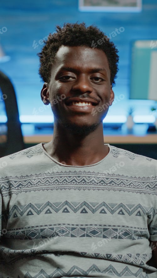 Preview: Close up of adult looking at camera and smiling on couch