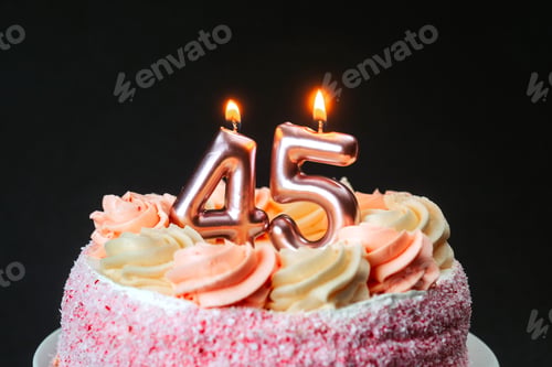 Preview: Birthday celebration with a cake featuring candles marking forty-five years