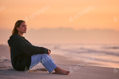 Preview: Casually Dressed Young Woman Watching Beautiful Sunrise Morning Over Beach And Sea In South Africa