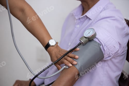 Preview: Mexican nurse measuring the blood pressure of the patient
