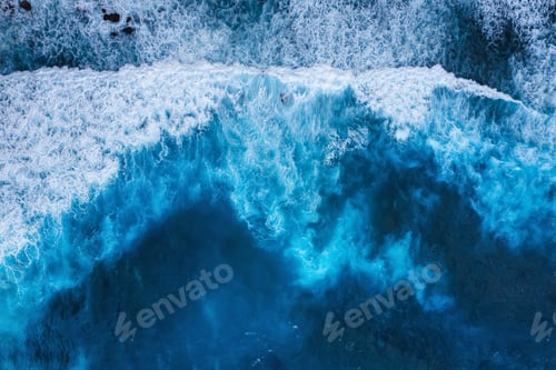 Preview: Waves as a background. Blue water background from top view. Sea and beach. Seacape from drone.
