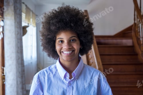 Preview: Portrait of smiling millennial attractive african american woman at home. Pretty happy lady