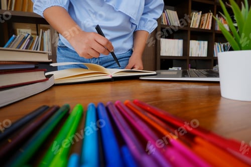 Preview: female student reading books study research in library for education concept