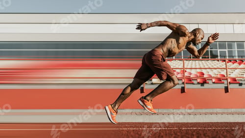 Preview: Side view shot of male sprinter running on the sport track. Athlete runner doing workout