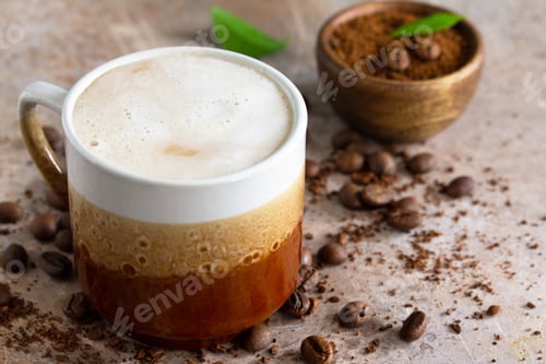 Preview: Morning coffee concept. Cup of coffee latte and coffee beans. Photo nominated.