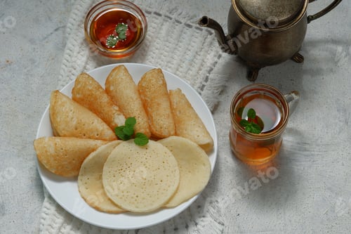 Preview: Moroccan pancakes, Arabic pancakes - Baghrir served with honey and mint tea