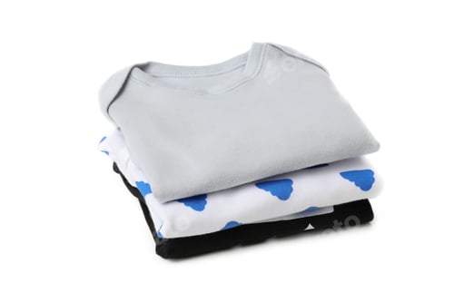 Preview: Stack of baby clothes isolated on background