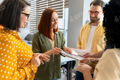 Preview: Confident inspired creative group of ethnic office workers discussing sales growth charts in office