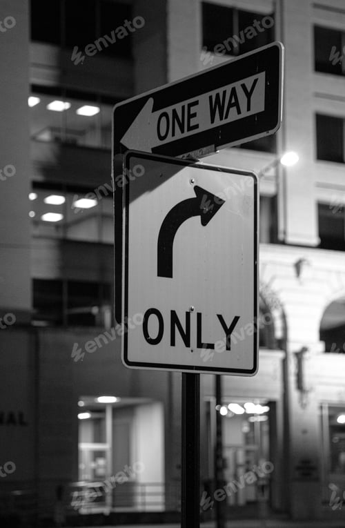 Preview: Vertical shot of street signs 'Only Right' and 'One Way'