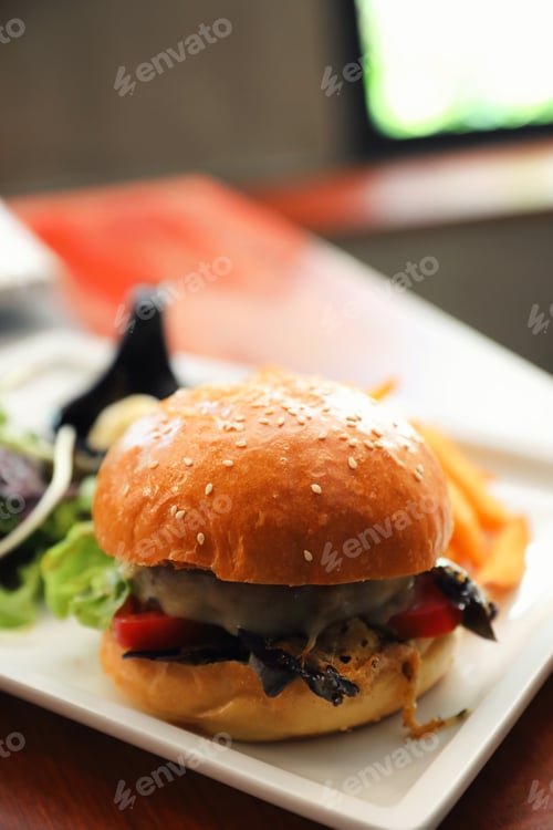 Preview: Beef Hamburger With Fries And Salad On Wooden Background