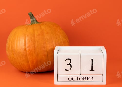 Preview: Halloween October 31 calendar and pumpkin on orange background.