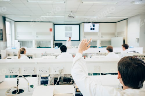 Preview: Student raising hand in a science classroom