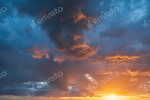 Preview: Glowing real sky at sunset texture background overlay. Dramatic red and orange clouds.