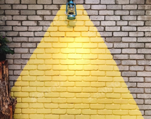 Preview: An antique lamp hanging on a yellow and grey colour brick wall 41
