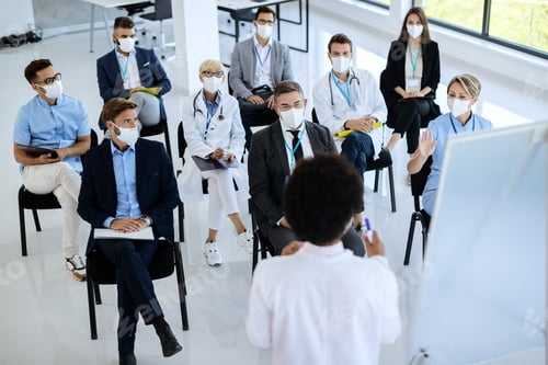 Preview: Medical Staff Attending Presentation Wearing Protective Face Masks