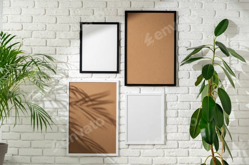 Preview: Varied Sized Photo Frames Displayed on a White Brick Wall