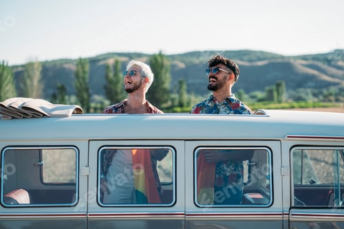 Preview: Gay couple in van holding LGBT flag