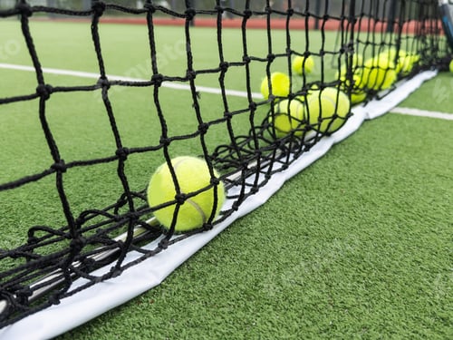 Preview: rackets and paddle balls on a court ready to play