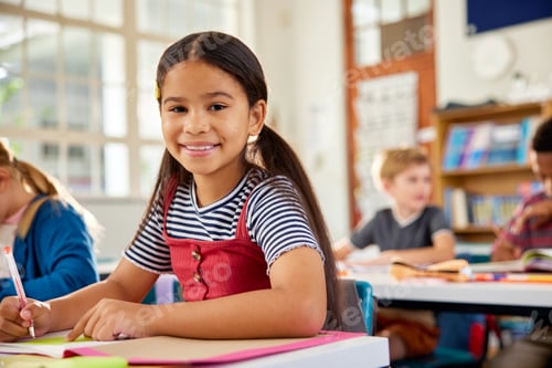 Preview: Portrait of happy hispanic girl looking at camera in elementary classroom
