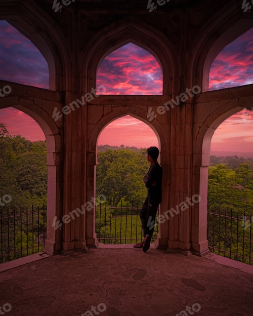 Preview: Boy standing and watching beautiful sight from a ancient palace