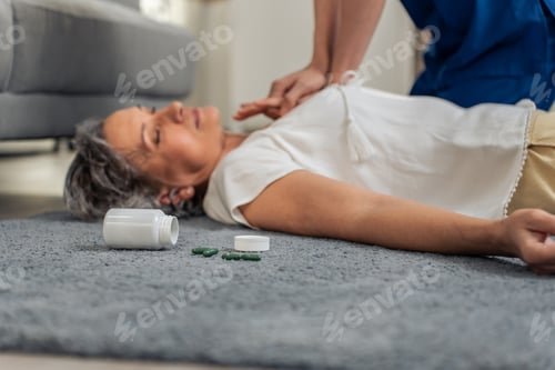 Preview: Asian caregiver saving senior woman's life by doing cpr in emergency.