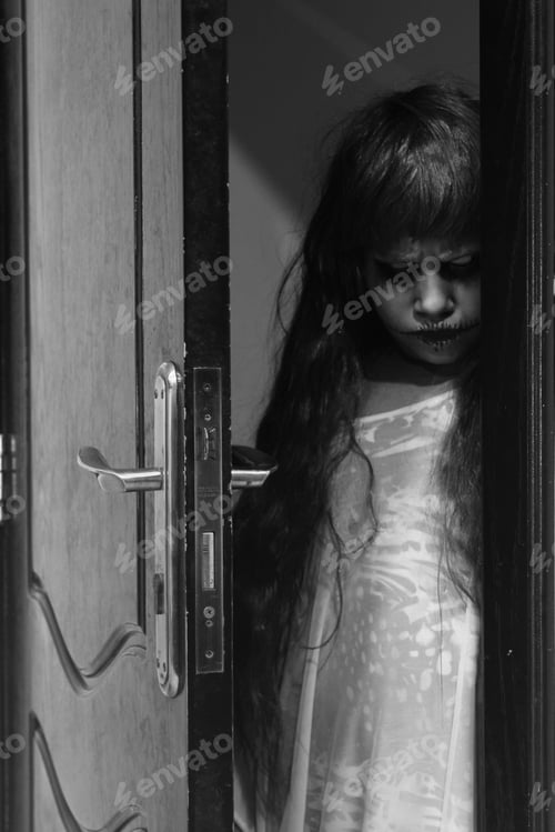 Preview: Spooky little girl staring from behind the door