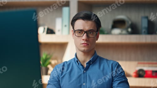 Preview: Annoyed freelancer picking smartphone up at office closeup. Man feeling nervous
