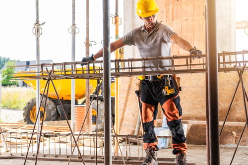 Preview: Construction Worker Assembling Rebar at a Building Site During Daylight