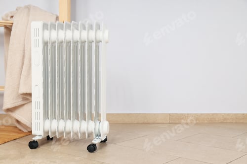 Preview: Concept of heating season, modern electric heater in room
