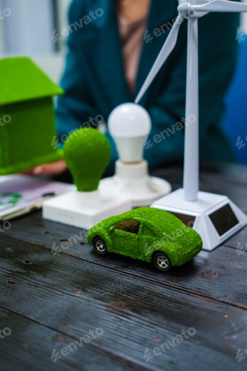 Preview: An Asian businesswoman sits at her desk, discussing clean energy solutions their impact on homes