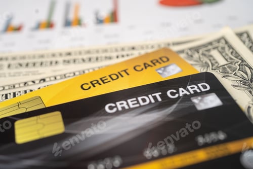 Preview: Credit card with US dollar banknote on chart and graph paper. Finance development,