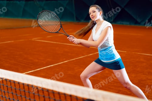 Preview: Attractive woman tennis player waiting for service at indoor court