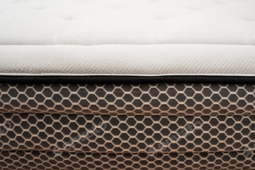Preview: Detail of the spongy material of the upper fabric of a mattress for comfortable sleeping.