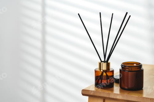 Preview: Aromatherapy Reed Diffuser and Scented Candle on a Wooden Table in a Cozy Room
