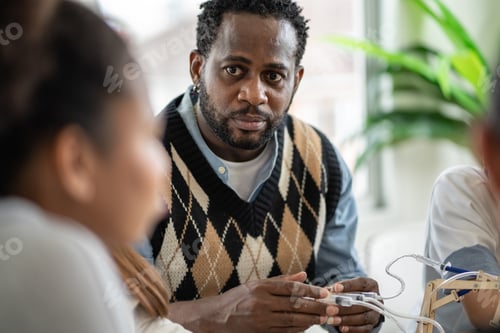 Preview: African American teacher showing science equipment experiment in the classroom