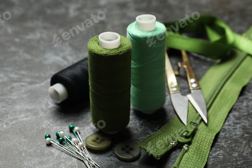 Preview: Sewing supplies on black smokey background, close up