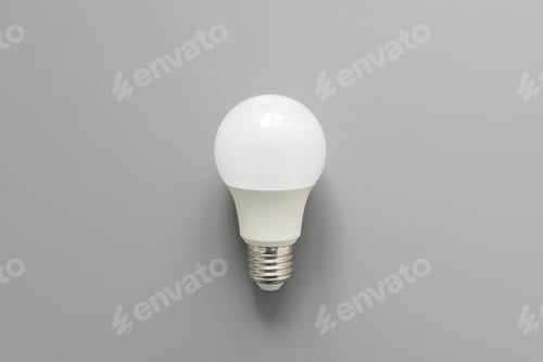 Preview: Light bulb on gray background close up