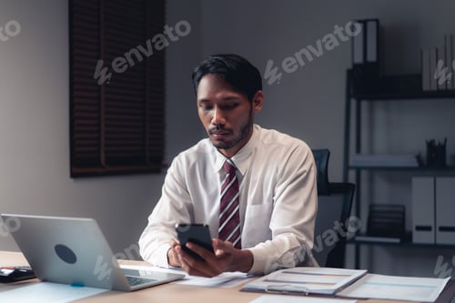 Preview: Businessman using smartphone to checking report while analysis financial and accounting of project