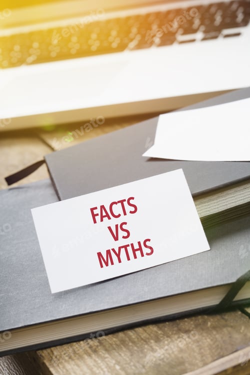 Preview: Facts vs Myths on card at office desktop