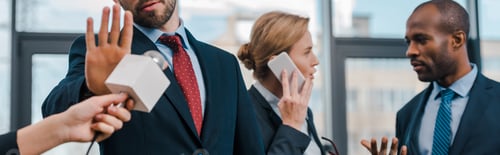 Preview: panoramic shot of man showing no gesture near journalist with microphone and multicultural diplomats